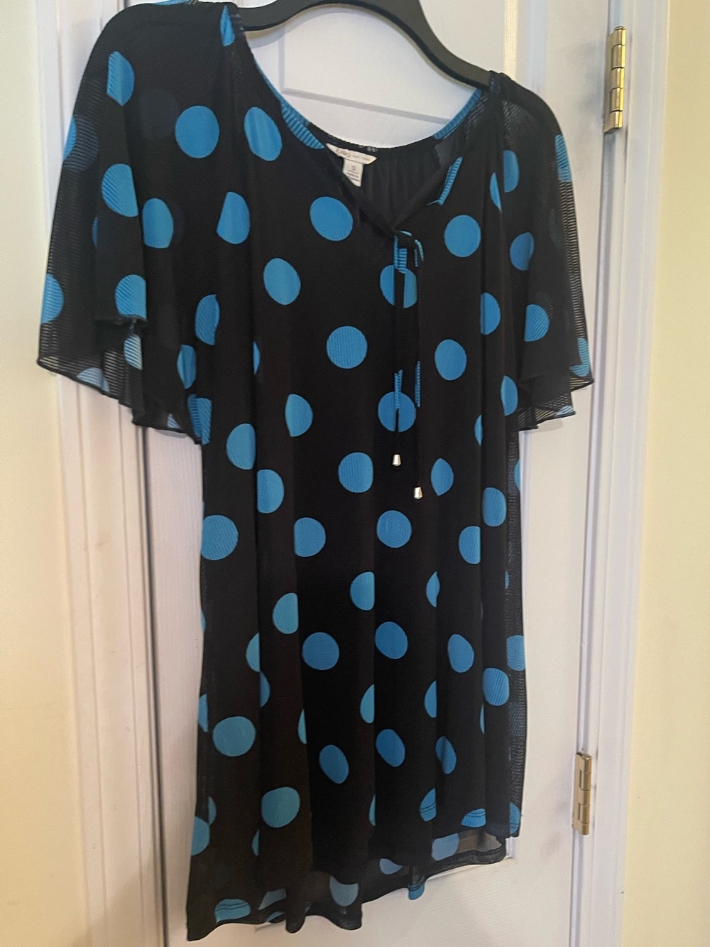 Ladies black top with teal polka dote